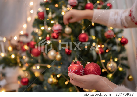 Woman with gift and present for Christmas and New Year party at home. Woman with gift and present for Christmas and New Year party at home. 83779958