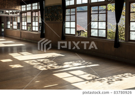 A retro auditorium where the shadows on the windowsill invite nostalgia [nostalgia] 83780926