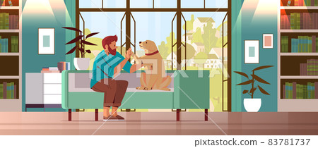 young man spending time with dog male owner and cute domestic animal friendship with pet concept young man spending time with dog male owner and cute domestic animal friendship with pet concept 83781737