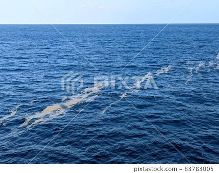 Pumice belt floating on the sea Pumice belt floating on the sea 83783005