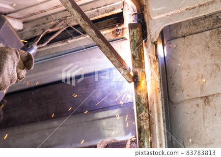 Worker welding the steel part by manual 83783813