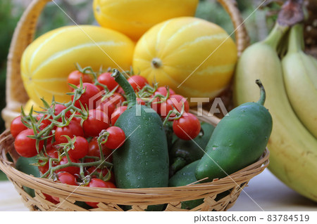 Summer Fruit and Vegetable Harvest - Ginkaku Korean Melons with Pineapple, Bananas, Jalapeno Peppers and Tomatoes 83784519