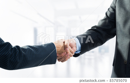 Close-up of the handshake of businessmen. Close-up of the handshake of businessmen. 83785070