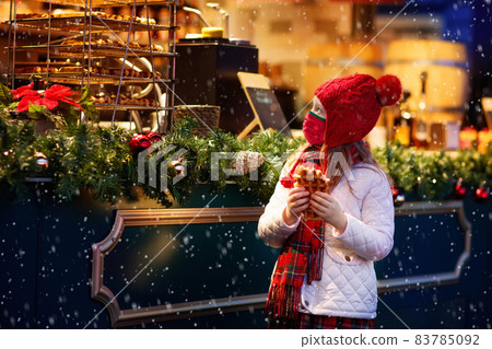 Kids at Christmas fair. Child at Xmas market. Kids at Christmas fair. Child at Xmas market. 83785092