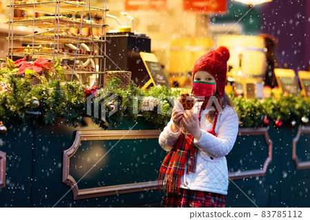 Kids at Christmas fair. Child at Xmas market. Kids at Christmas fair. Child at Xmas market. 83785112