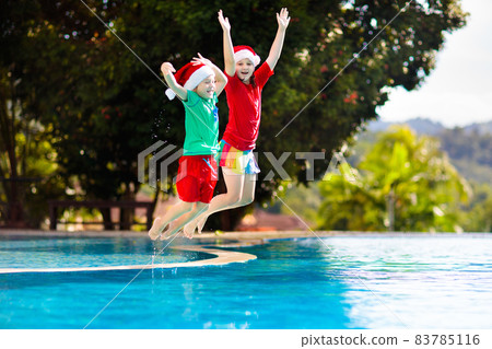 Christmas vacation on tropical island. Xmas kids. 83785116
