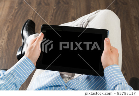 businessman with a tablet, works in the office businessman with a tablet, works in the office 83785117