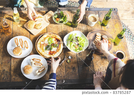 Hands of young people enjoying a party 83785287