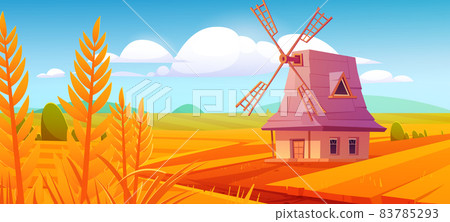 Windmill on farm nature landscape, plowed field 83785293