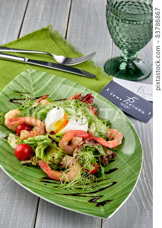 Salad from shrimp with lettuce, arugula, eggs, tomatoes, olive oil and balsamic vinegar. Salad from shrimp with lettuce, arugula, eggs, tomatoes, olive oil and balsamic vinegar. 83786867