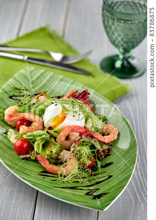 Salad from shrimp with lettuce, arugula, eggs, tomatoes, olive oil and balsamic vinegar. Salad from shrimp with lettuce, arugula, eggs, tomatoes, olive oil and balsamic vinegar. 83786875