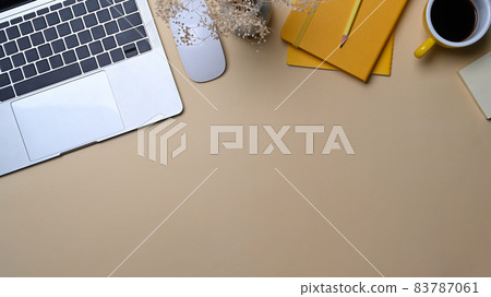 Female workspace with laptop computer, coffee cup and notebook. 83787061