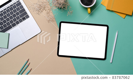 Mock up digital tablet, laptop computer and notebooks on creative designer workspace. 83787062