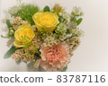 A bouquet of fashionable roses and carnations in pale shades 83787116
