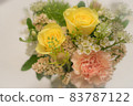 A bouquet of fashionable roses and carnations in pale shades 83787122