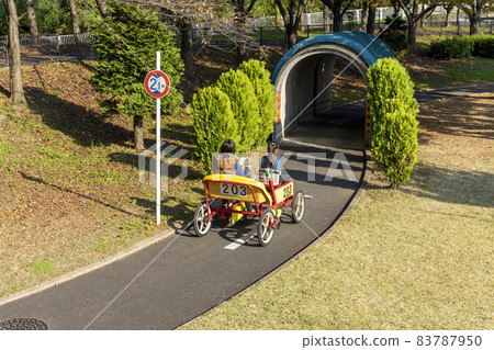 A girl riding a cycle cart in the Kanagawa Forest A girl riding a cycle cart in the Kanagawa Forest 83787950