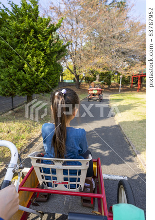 A girl riding a cycle cart in the Kanagawa Forest A girl riding a cycle cart in the Kanagawa Forest 83787952