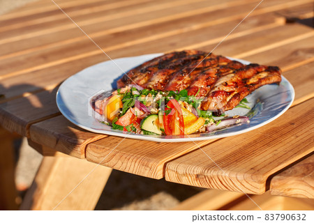 BBQ ribs sliced with hot honey and chili marinade BBQ ribs sliced with hot honey and chili marinade 83790632