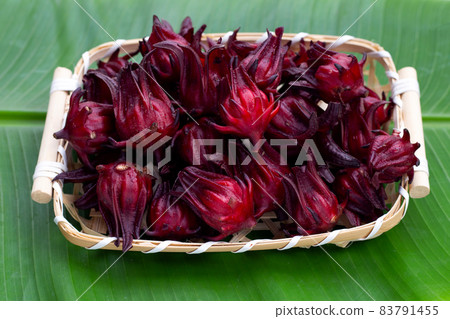 Roselle flower in bamboo basket on banana leaf 83791455
