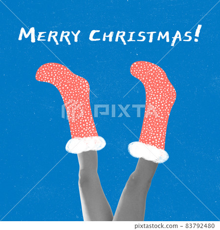 Contemporarty art collage of female legs wearing drawn res socks isolated over blue background. Christmas and New Year concept Contemporarty art collage of female legs wearing drawn res socks isolated over blue background. Christmas and New Year concept 83792480