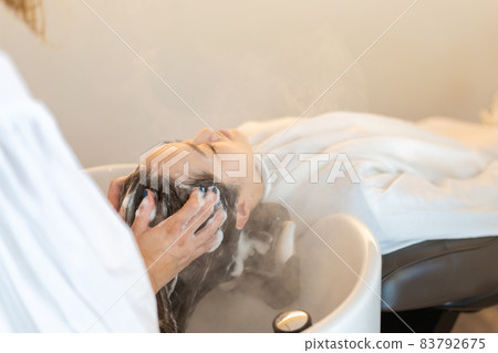 A woman who goes to a hair salon 83792675