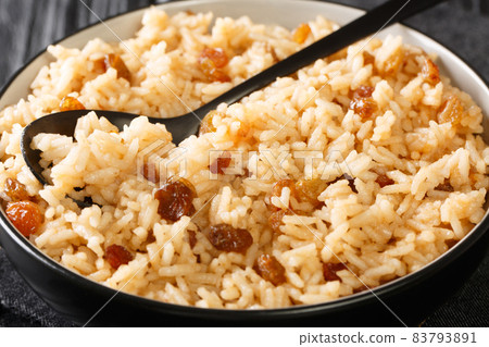 Coconut Rice With Raisins Arroz con Coco close up in the bowl. Horizontal 83793891
