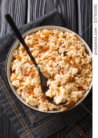 Authentic Colombian Arroz Con Coco Coconut Rice is a classic dish native to the Carribean coastal regions of Colombia close up in the bowl. Vertical top view 83793898
