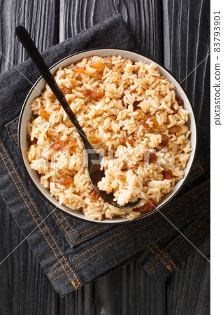 Arroz Con Coco Colombian Coconut Rice close up in the bowl. Vertical top view 83793901