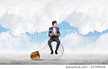 young businessman with a book young businessman with a book 83794044