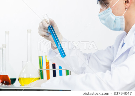 Laboratory technician in safety mask and gloves Laboratory technician in safety mask and gloves 83794047