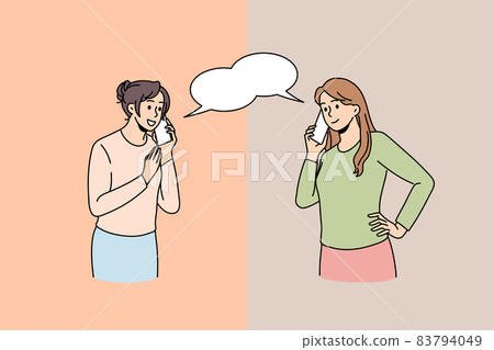 Smiling women talk on cellphone devices online Smiling women talk on cellphone devices online 83794049