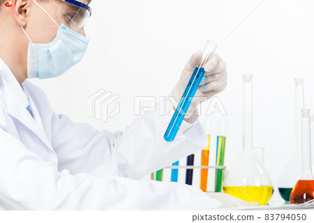 Laboratory technician in safety mask and gloves Laboratory technician in safety mask and gloves 83794050