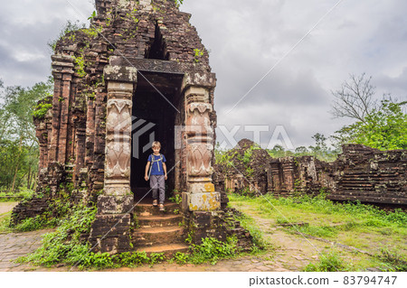 Boy tourist in Temple ruin of the My Son complex, Vietnam. Vietnam opens to tourists again after quarantine Coronovirus COVID 19 83794747
