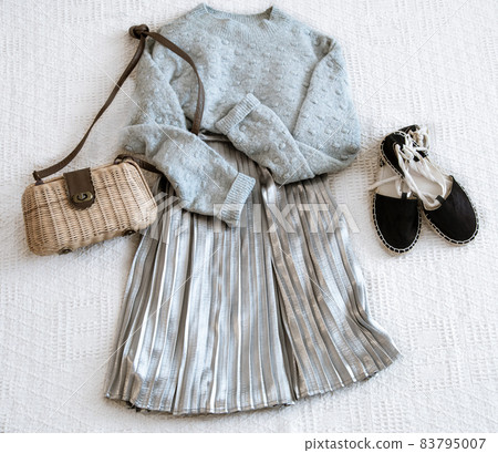 Set with fashionable women's clothing skirt and sweater. 83795007