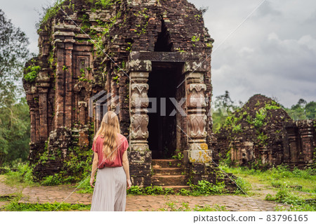 Woman tourist in Temple ruin of the My Son complex, Vietnam. Vietnam opens to tourists again after quarantine Coronovirus COVID 19 83796165