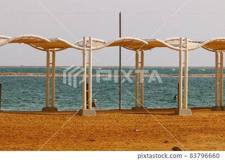 Sandy beach on the shores of the Dead Sea (Sodom Sea) in the desert in southern Israel. 83796660