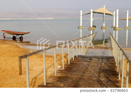 Sandy beach on the shores of the Dead Sea (Sodom Sea) in the desert in southern Israel. Sandy beach on the shores of the Dead Sea (Sodom Sea) in the desert in southern Israel. 83796663