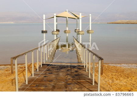 Sandy beach on the shores of the Dead Sea (Sodom Sea) in the desert in southern Israel. Sandy beach on the shores of the Dead Sea (Sodom Sea) in the desert in southern Israel. 83796665