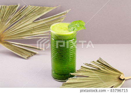 Green smoothy with spinach, banana, apple, kiwi and mint in glass jar. Detox, diet, healthy 83796715