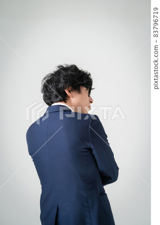 Businessman worried back view 83796719