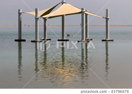 Sandy beach on the shores of the Dead Sea (Sodom Sea) in the desert in southern Israel. Sandy beach on the shores of the Dead Sea (Sodom Sea) in the desert in southern Israel. 83796878