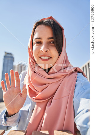Female blogger greeting with her subscribers while recording her video blog 83796906