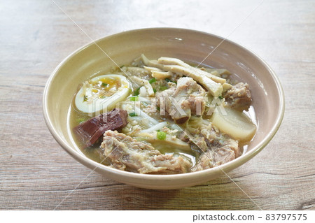 Vietnamese rice noodles or Pho with slice sausage and pork bone soup on bowl 83797575