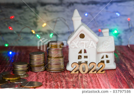 A new house as a gift. Money for the holiday. Holiday New Year and Christmas 2022. 83797586
