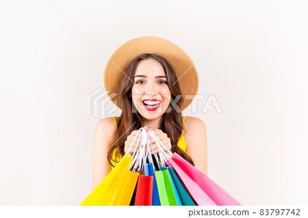 Young beautiful model with lots of shopping bags in hands. 83797742