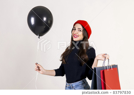 Happy brunette female with long hair in casual outfit posing over isolated white background. 83797830