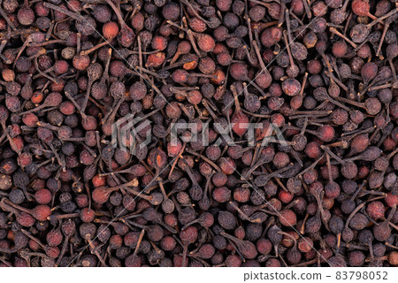 Bourbon pepper background. Voatsiperifery or bourbonese piper. Madagascar pepper. Top view. 83798052