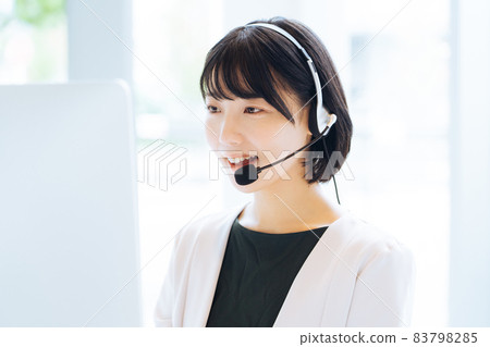 Female operator working at a call center 83798285