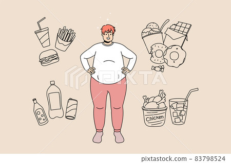 Happy fat man surrounded by junk food products  83798524