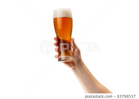 Cropped image of male hand holding glass of lager foamy beer isolated over white background Cropped image of male hand holding glass of lager foamy beer isolated over white background 83798537